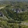 Covington Ky Apartments - Tapestry Ridge-Aerial view of Tapestry Ridge apartments surrounded by lush green forest, beautiful green hills, and scenic drive through trees
